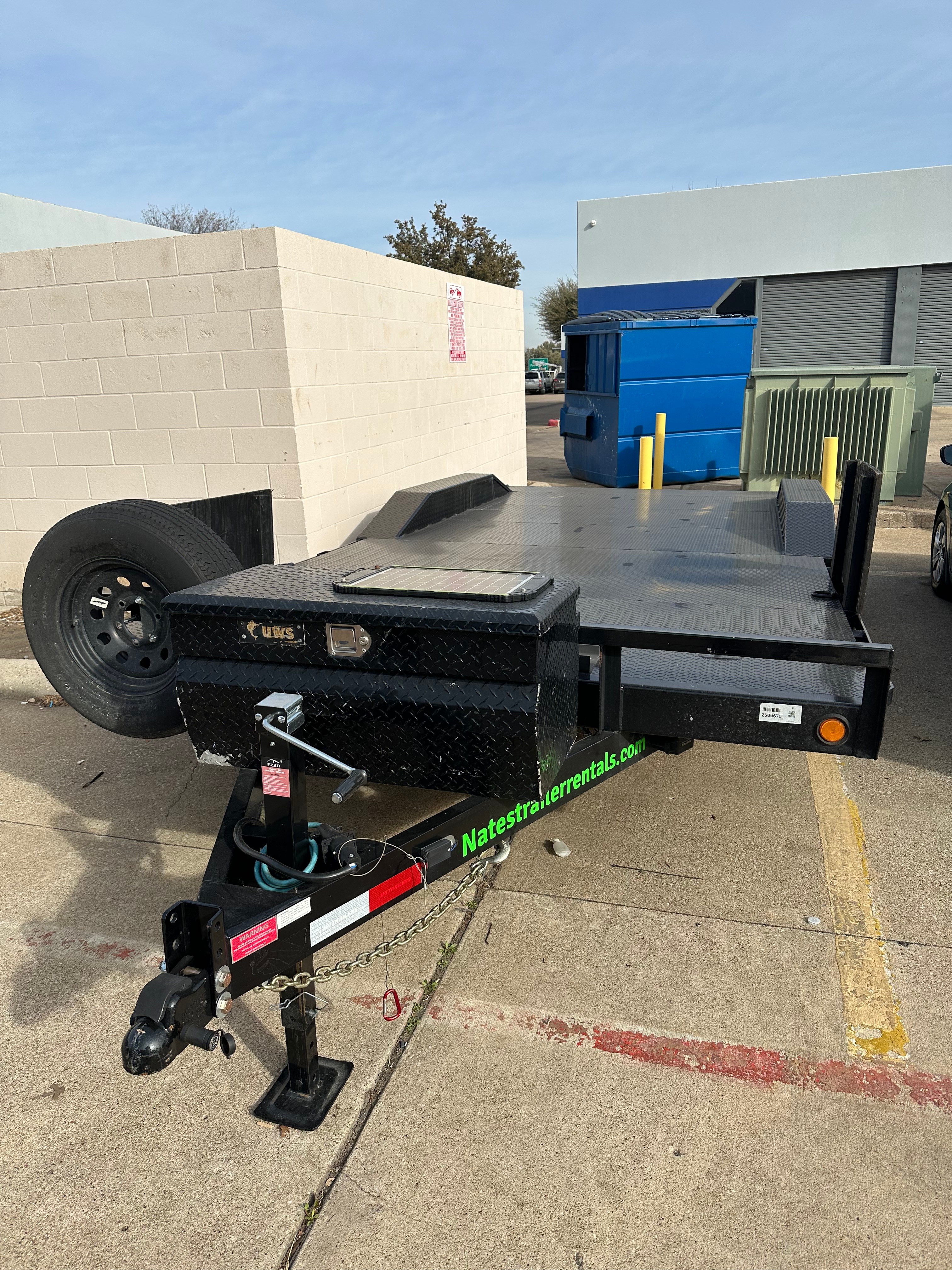 Nates Trailer Rentals 20ft PJ Trailers B5 car hauler flatbed trailer parked at facility in Hurst Texas